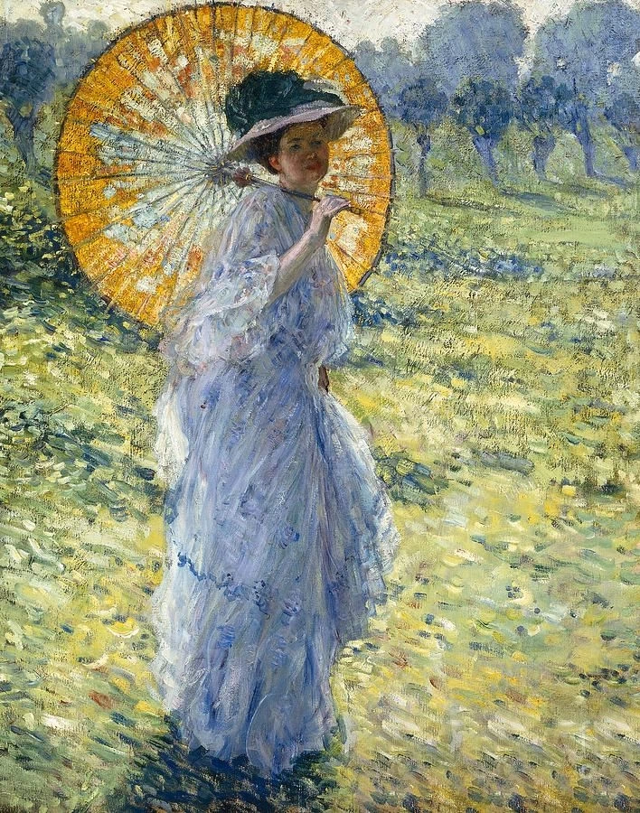 Donna in un prato con parasole
